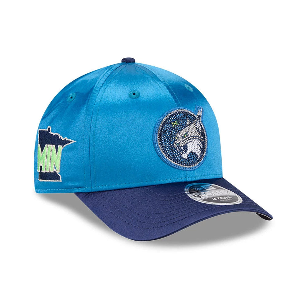 Minnesota Lynx WNBA Draft 2026 Blue New Era 9FORTY M-Crown Adjustable Cap, front view showing an embroidered Lynx logo on the front panel with glittering accents, blue crown, a navy curved visor, and a 9FORTY size sticker on the visor.