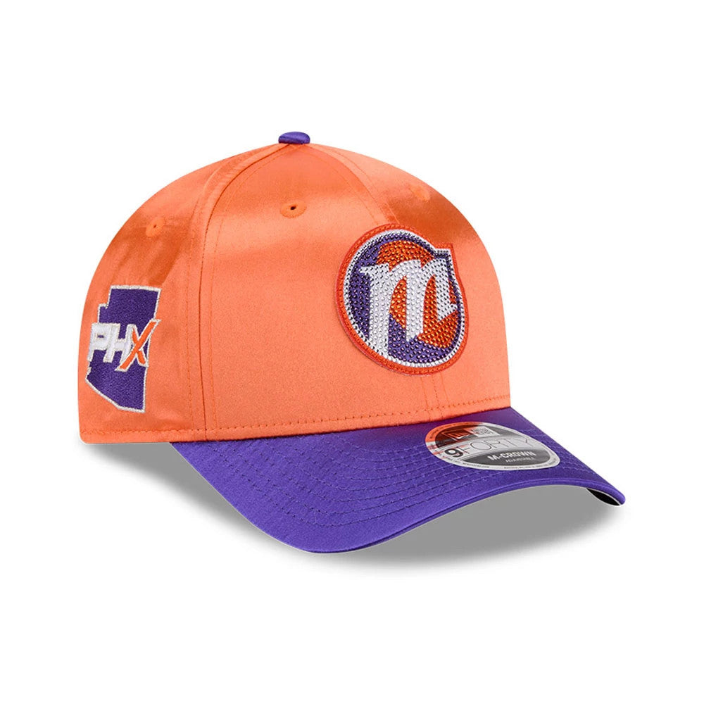 Phoenix Mercury WNBA Draft 2026 Orange New Era 9FORTY M-Crown Adjustable Cap, three-quarter view showing a raised embroidered Phoenix M logo on the front panel, a purple visor with a 9FORTY size sticker, and PHX state logo on the left side.