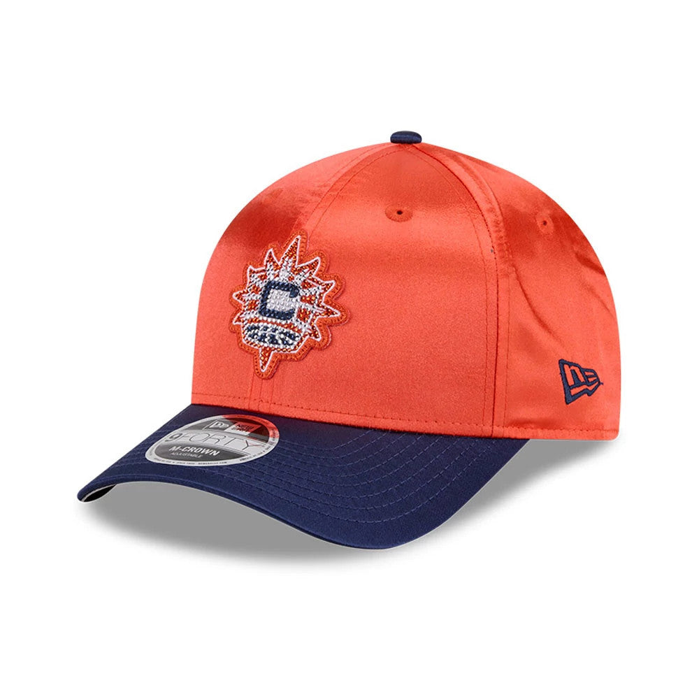 Connecticut Sun WNBA Draft 2026 Orange New Era 9FORTY M-Crown Adjustable Cap, three-quarter view showing the front embroidered team logo on the orange crown, contrasting with the dark navy curved visor and the New Era flag logo on the left side.