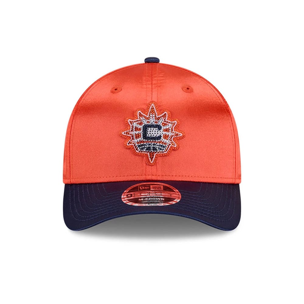 Connecticut Sun WNBA Draft 2026 Orange New Era 9FORTY M-Crown Adjustable Cap, front view showing the blue and white embroidered sunflower logo on the orange front panel, with a navy curved visor and 9FORTY size sticker on the centre.