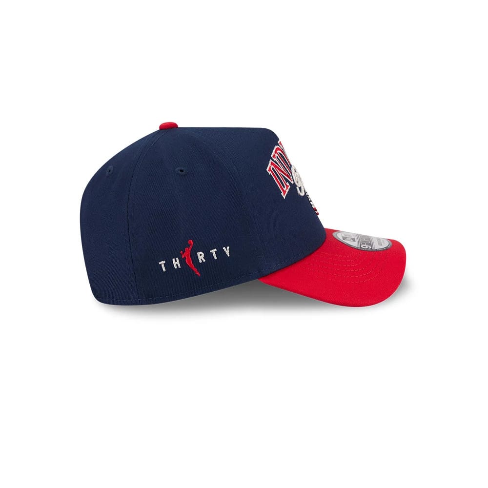 Indiana Fever WNBA Tip Off 2026 Navy New Era 9FORTY A-Frame Adjustable Cap, side view showing red embroidered THIRTY lettering with a basketball silhouette on the navy crown, a red curved visor and a 9FORTY size sticker on top.