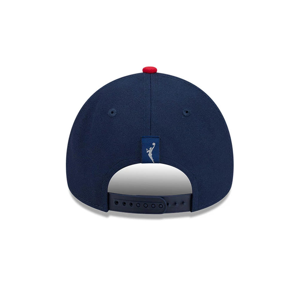 Washington Mystics WNBA Tip Off 2026 Navy New Era 9FORTY A-Frame Adjustable Cap, rear view showing the white embroidered WNBA logo on a navy strapback closure, with a red top button and navy eyelets centred on the structured navy crown.