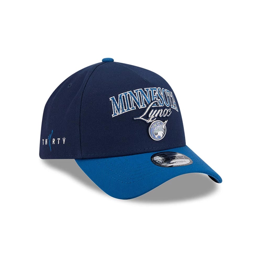 Minnesota Lynx WNBA Tip Off 2026 Navy New Era 9FORTY A-Frame Adjustable Cap, three-quarter view with a raised embroidered Minnesota Lynx logo on the navy front panel, blue curved visor and 9FORTY size sticker, plus side WNBA logo.