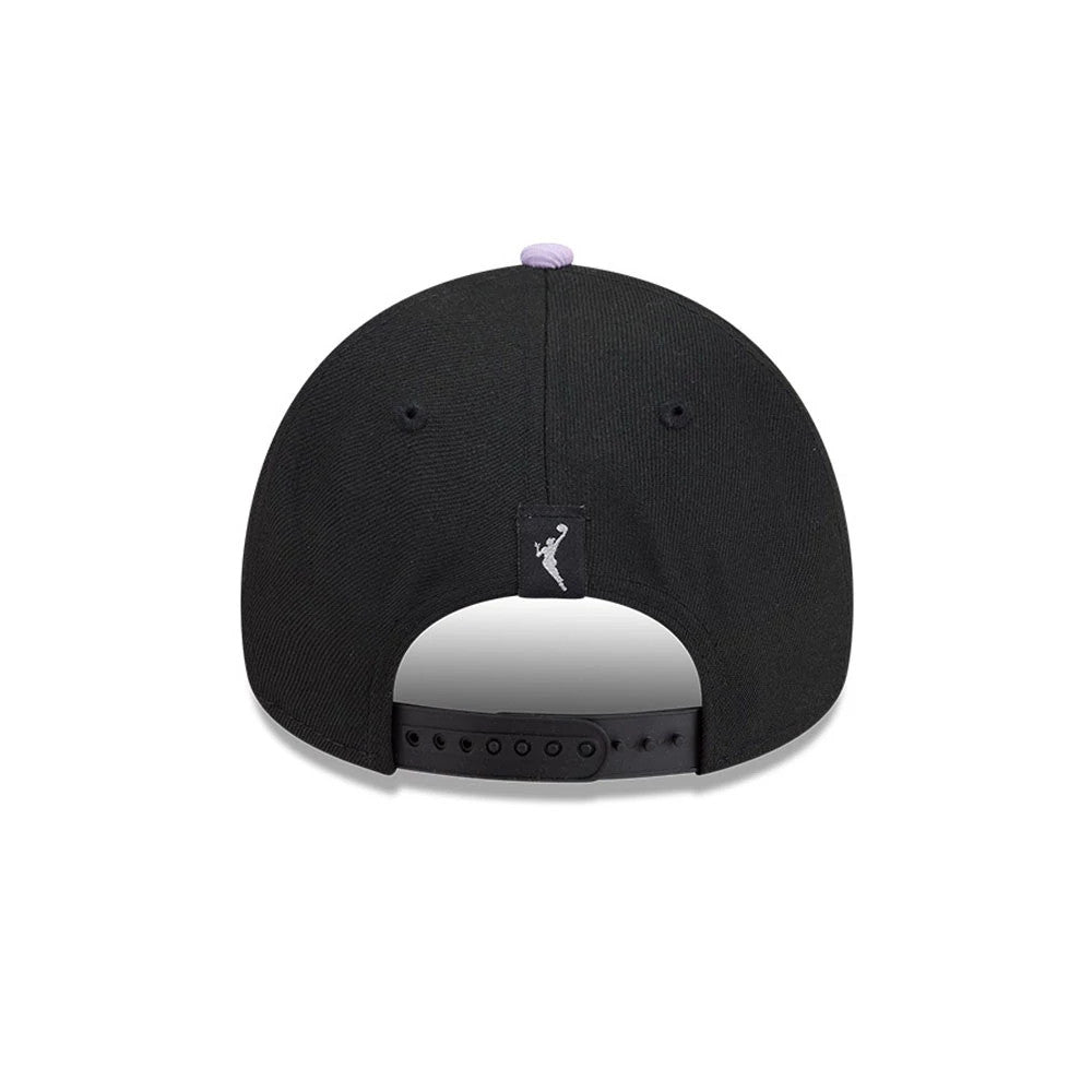 Golden State Valkyries WNBA Tip Off 2026 Black New Era 9FORTY A-Frame Adjustable Cap, rear view showing a silver WNBA logo label centred on the back panel, black snap closure, and purple top button contrasting with the black structured crown.