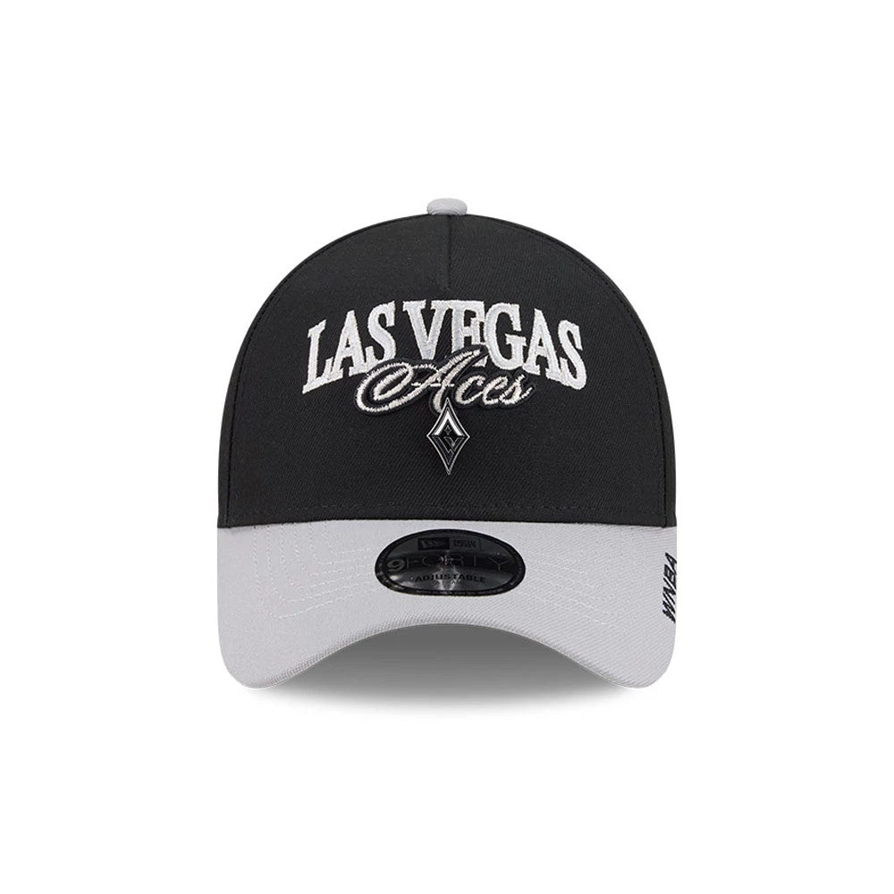 Las Vegas Aces WNBA Tip Off 2026 Black New Era 9FORTY A-Frame Adjustable Cap, front view showing the white embroidered Las Vegas Aces logo on the structured black crown, with a contrasting grey curved visor and a 9FORTY size sticker on it.