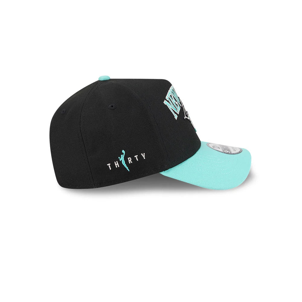 New York Liberty WNBA Tip Off 2026 Black New Era 9FORTY A-Frame Adjustable Cap, side view showing the teal THIRTY script logo embroidered on the black crown, with a mint green curved visor and blue top button.