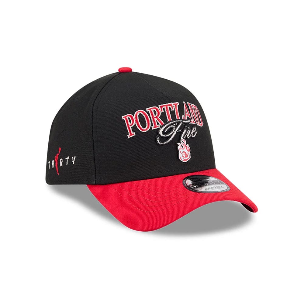 WNBA Portland Fire Tip Off 2026 Red New Era 9FORTY A-Frame Adjustable Cap, three-quarter view showing the raised Portland Fire text embroidered on the front, red embroidered flames below, a contrasting red curved visor and 9FORTY size sticker.