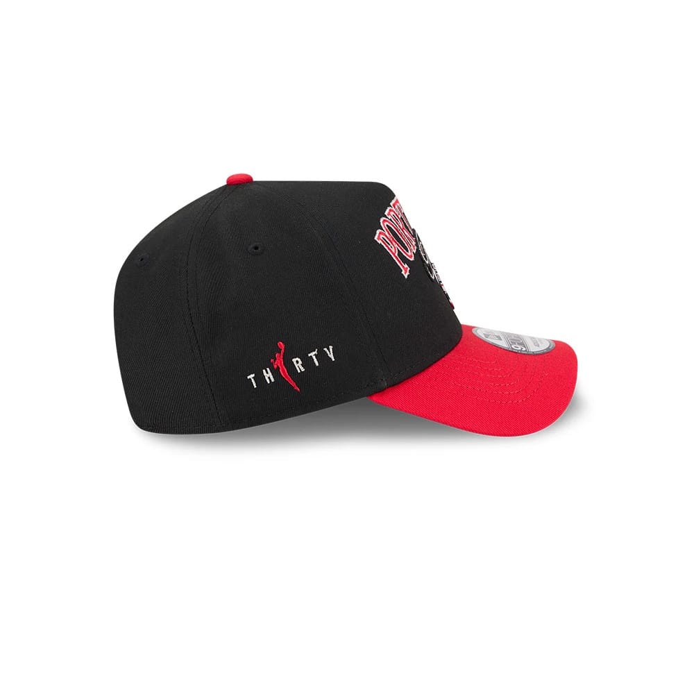WNBA Portland Fire Tip Off 2026 Red New Era 9FORTY A-Frame Adjustable Cap, side view showing the embroidered Thirty logo in red and white on the black crown, with a contrasting red visor and a 9FORTY size sticker on the visor.