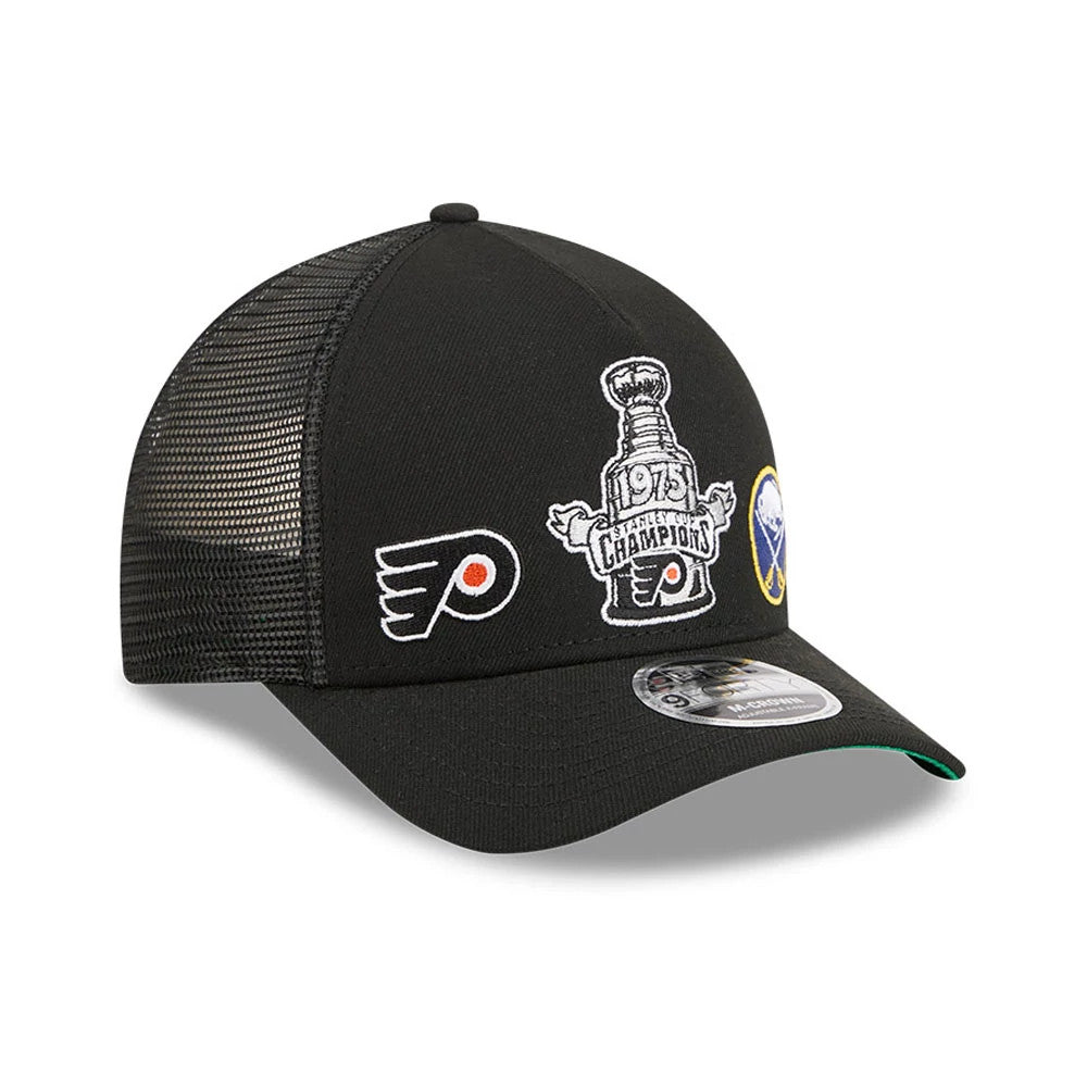 Flyers NHL Stanley Cup Black New Era 9FORTY M-Crown A-Frame Trucker Adjustable Cap, three-quarter view showing the 1975 Stanley Cup Champions logo embroidered on the front panel, with a Flyers logo to the left.
