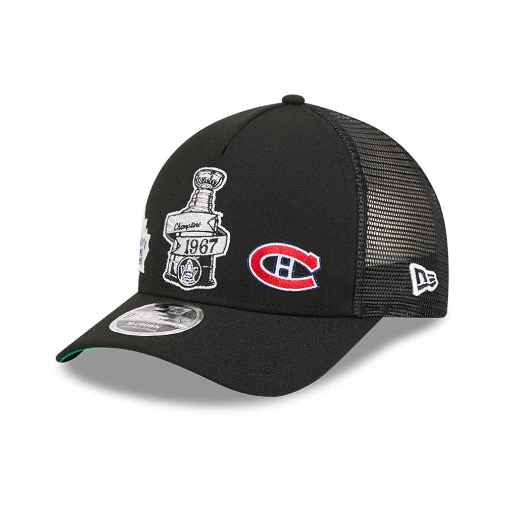 Maple Leafs NHL Stanley Cup Black New Era 9FORTY M-Crown A-Frame Trucker Adjustable Cap, three-quarter view showing a detailed embroidered Stanley Cup patch and a red and blue C logo on the front panels, with a mesh back and grey 9FORTY size sticker.