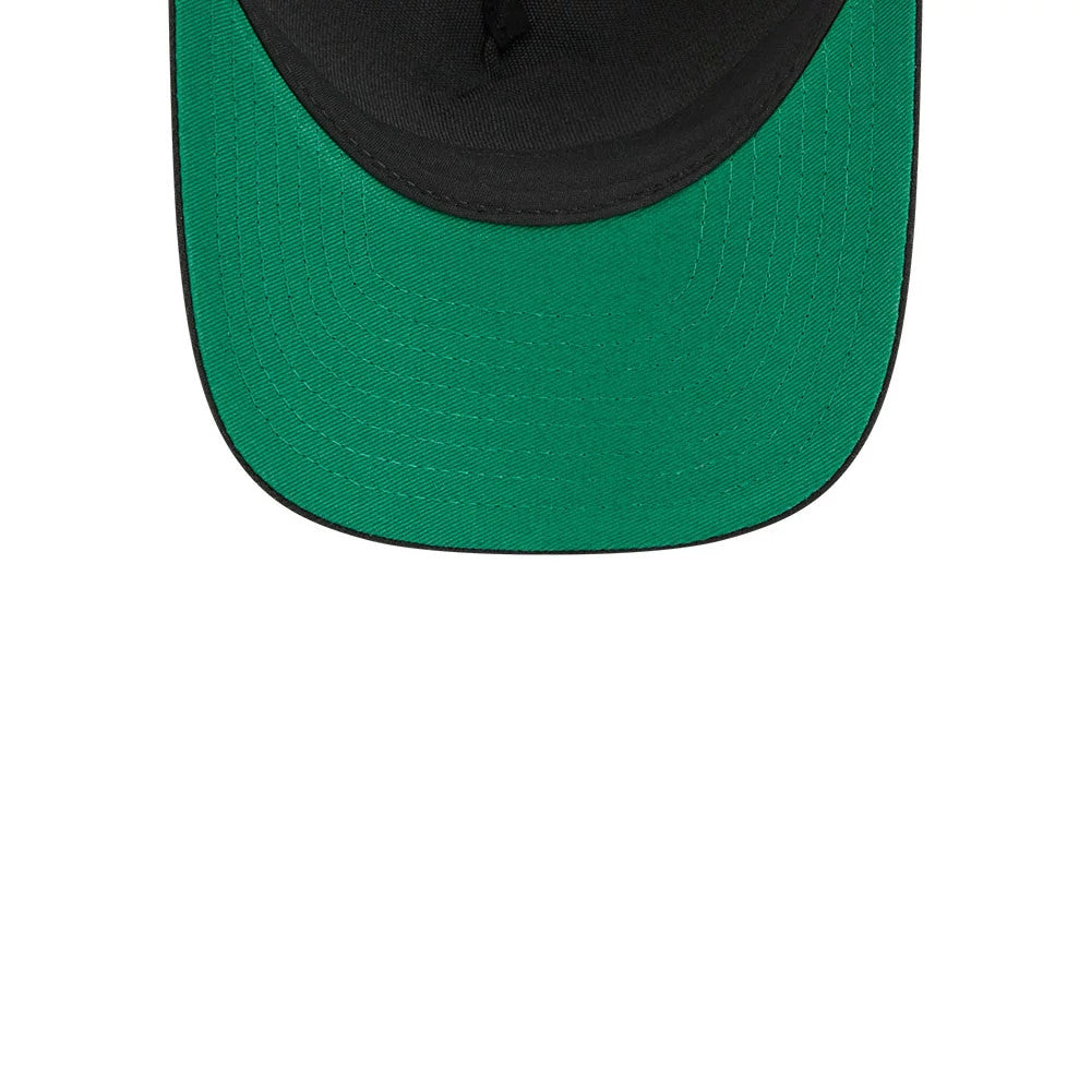 Ducks NHL Stanley Cup Black New Era 9FORTY M-Crown A-Frame Trucker Adjustable Cap, inside view showing the black sweatband and fully green undervisor with stitching, highlighting the structured craftsmanship and contrast between the visor.