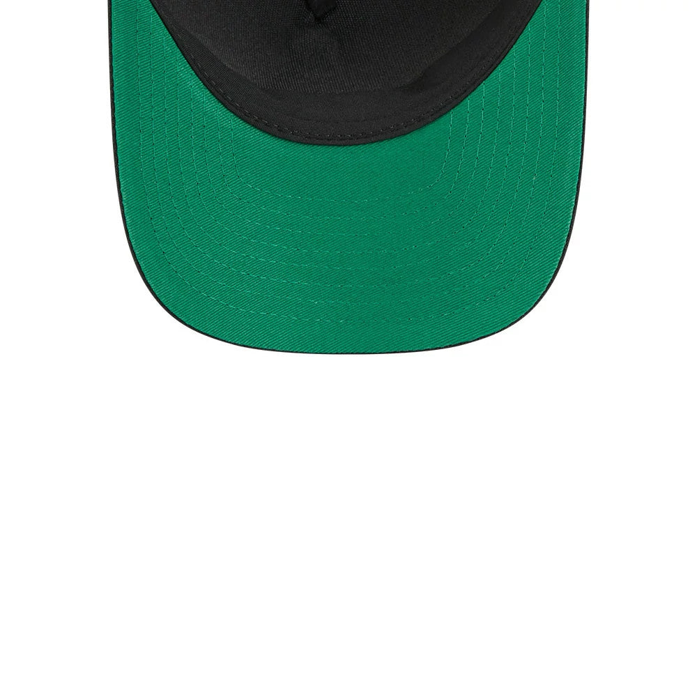 Oilers NHL Stanley Cup Black New Era 9FORTY M-Crown A-Frame Trucker Adjustable Cap, inside view showing a contrasting green undervisor beneath the black structured crown, with detailed stitching around the edge of the visor.