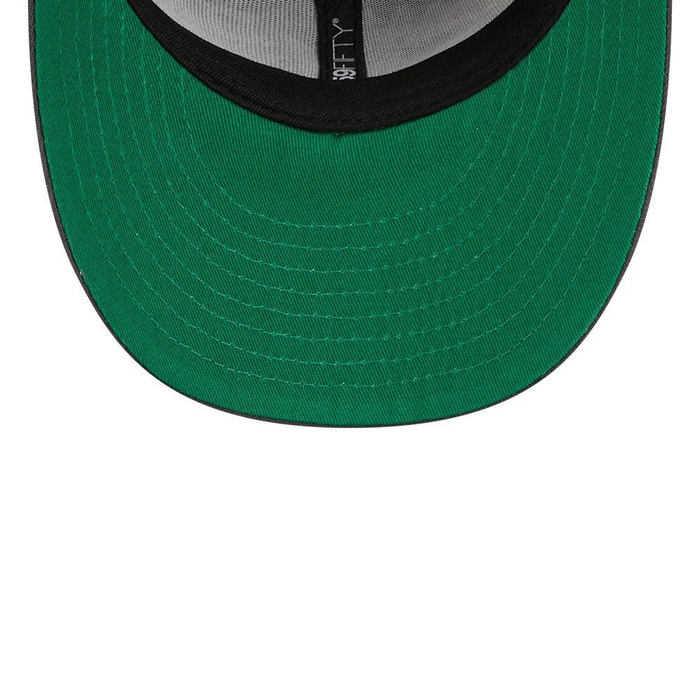 New York Rangers NHL Stanley Cup Champions Dark Grey New Era 59FIFTY Fitted Cap, inside view showing a green undervisor, black sweatband, and grey taping with a 59FIFTY logo along the seam, highlighting the cap’s construction details.
