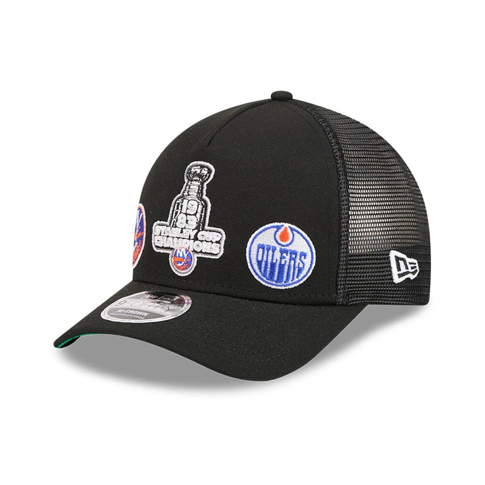 Islanders NHL Stanley Cup Black New Era 9FORTY M-Crown A-Frame Trucker Adjustable Cap, three-quarter view showing the front embroidered 1983 Stanley Cup Champions logo, Oilers logos on the front panels, black mesh side panels.