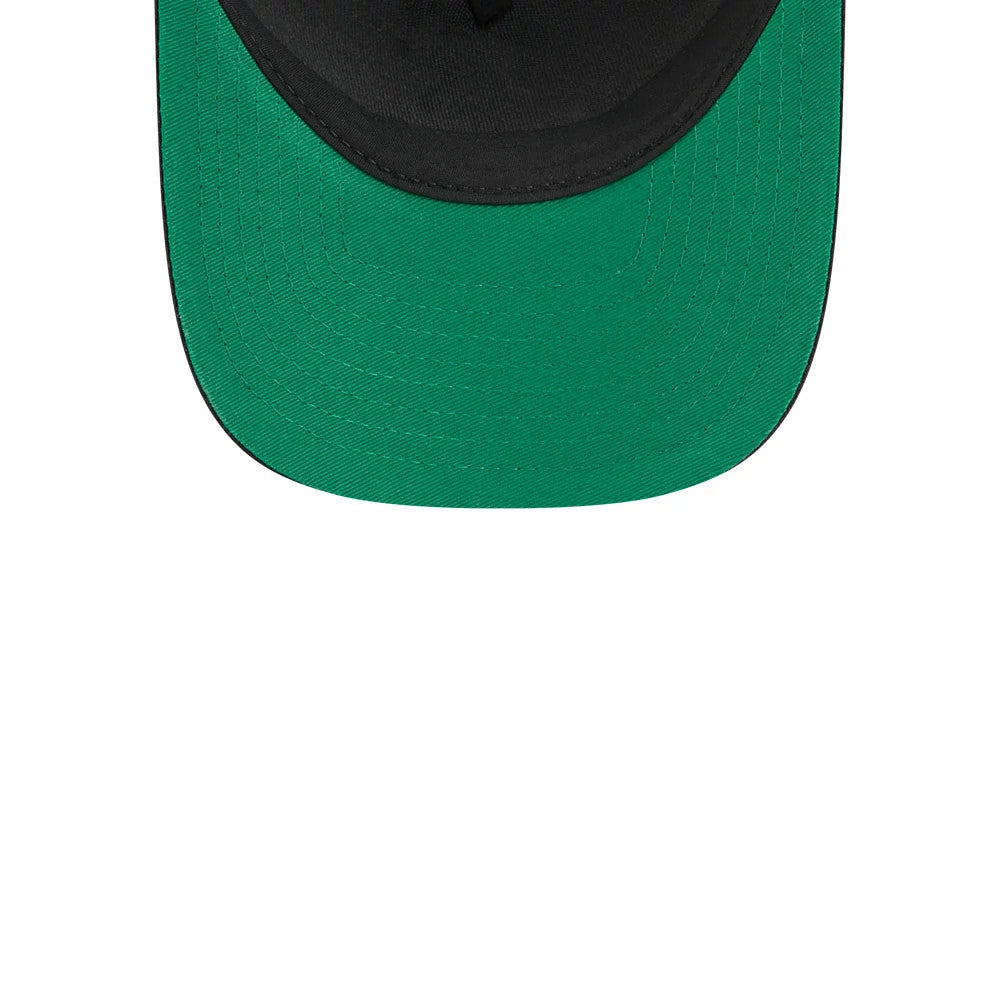 Islanders NHL Stanley Cup Black New Era 9FORTY M-Crown A-Frame Trucker Adjustable Cap, inside view showing a green undervisor with detailed stitching, black internal taping and the black sweatband along the structured inner crown.