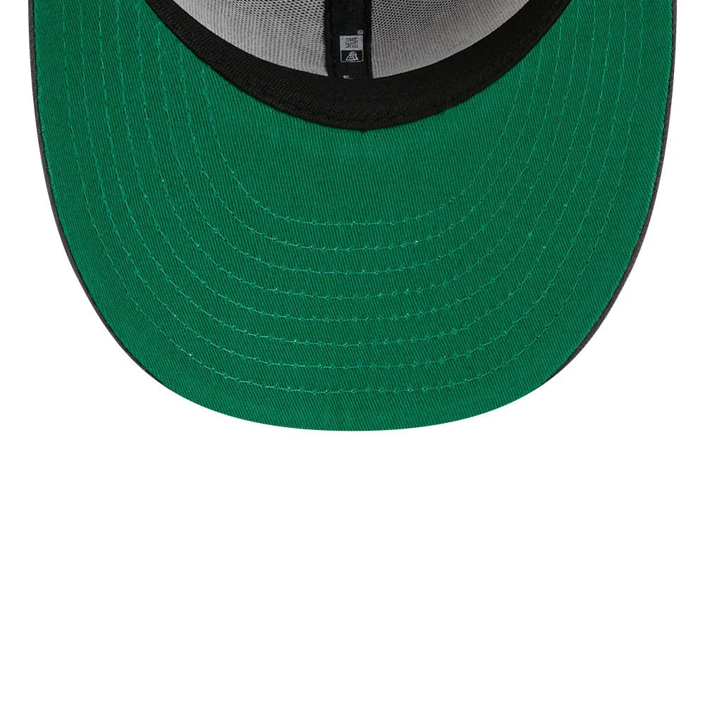 Chicago Blackhawks NHL Stanley Cup Champions Dark Grey New Era 59FIFTY Fitted Cap, inside view showing the green undervisor, black sweatband, and grey inner taping, highlighting the classic fitted style and structured design of the cap.