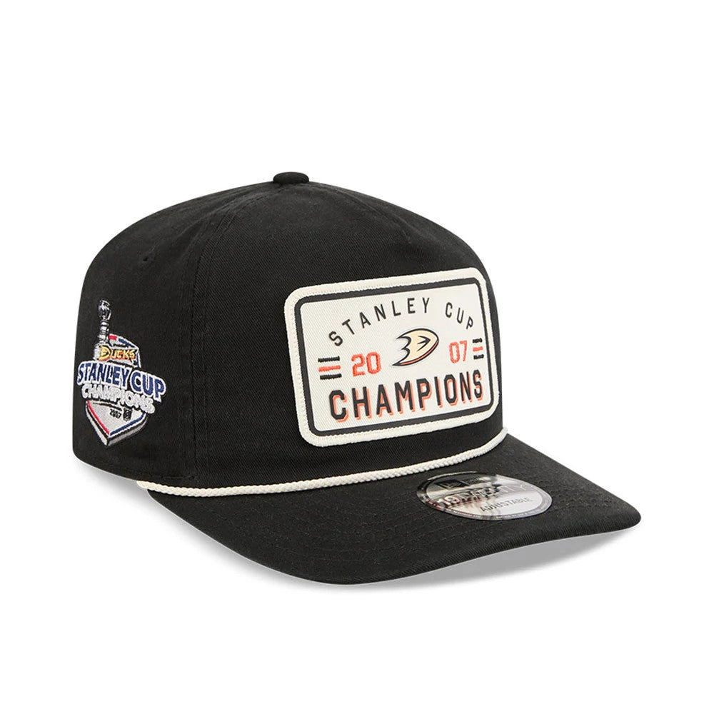 Anaheim Ducks NHL Stanley Cup Champions Black New Era 19TWENTY Adjustable Cap, three-quarter view showing the embroidered Stanley Cup Champions patch on the front panel, white rope detail above the black visor, and the 19TWENTY size sticker.