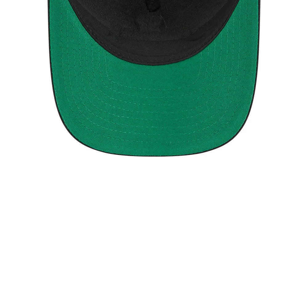 Canadiens NHL Stanley Cup Black New Era 9FORTY M-Crown A-Frame Trucker Adjustable Cap, close-up showing the green undervisor beneath the structured black crown and black visor, highlighting the detailed stitching on the curved visor edge.