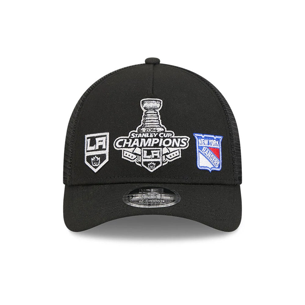 Kings NHL Stanley Cup Black New Era 9FORTY M-Crown A-Frame Trucker Adjustable Cap, front view showing the 2014 Stanley Cup Champions logo embroidered in white on the structured black crown, with LA.