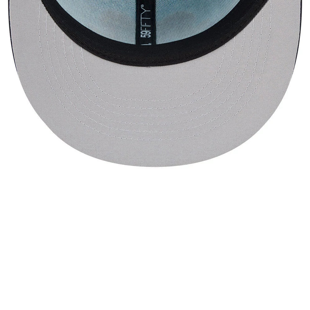 Yard Goats MiLB La Copa 2026 Bright Blue New Era 59FIFTY Fitted Cap, inside view showing light blue fabric taping with the 59FIFTY logo, a contrasting black sweatband, and a grey undervisor featuring meticulously aligned stitching lines.
