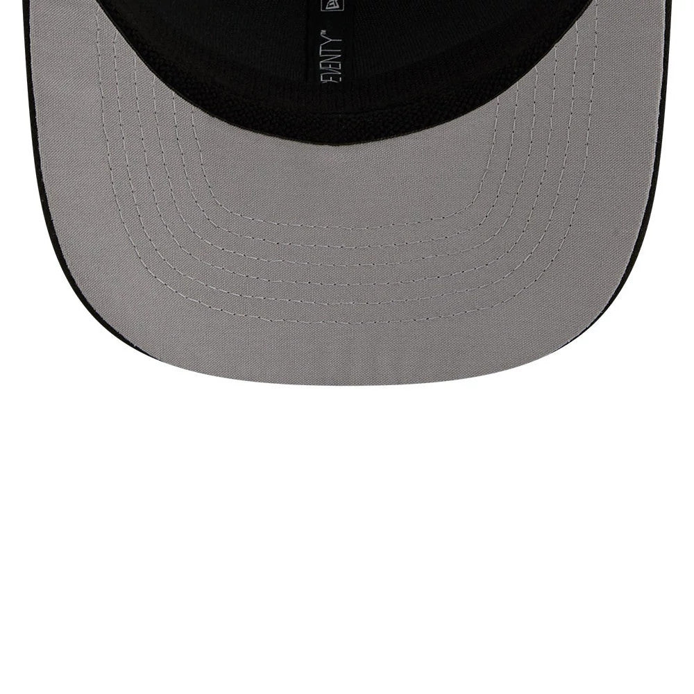 Buffalo Bisons MiLB La Copa 2026 Black New Era 9SEVENTY Stretch Snap Adjustable Cap, inside view showing the contrasting grey undervisor, black sweatband and taping with New Era branding.