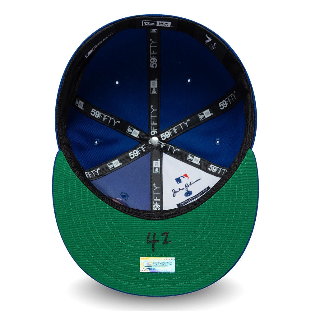 New York Mets MLB Jackie Robinson Blue New Era 59FIFTY Fitted Cap, inside view showing the blue fabric panels with black 59FIFTY taping, a green undervisor with the number 42, and printed signatures near the MLB and New Era logos.