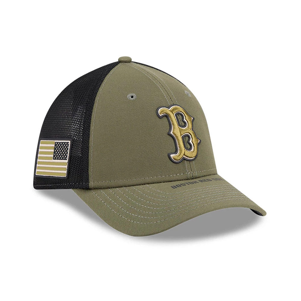 Red Sox MLB Armed Forces Day 2026 Green New Era 39THIRTY M-Crown Stretch Fit Cap, three-quarter view showing a gold embroidered B logo on the front panel, an American flag patch on the black mesh side, and matching green curved visor.