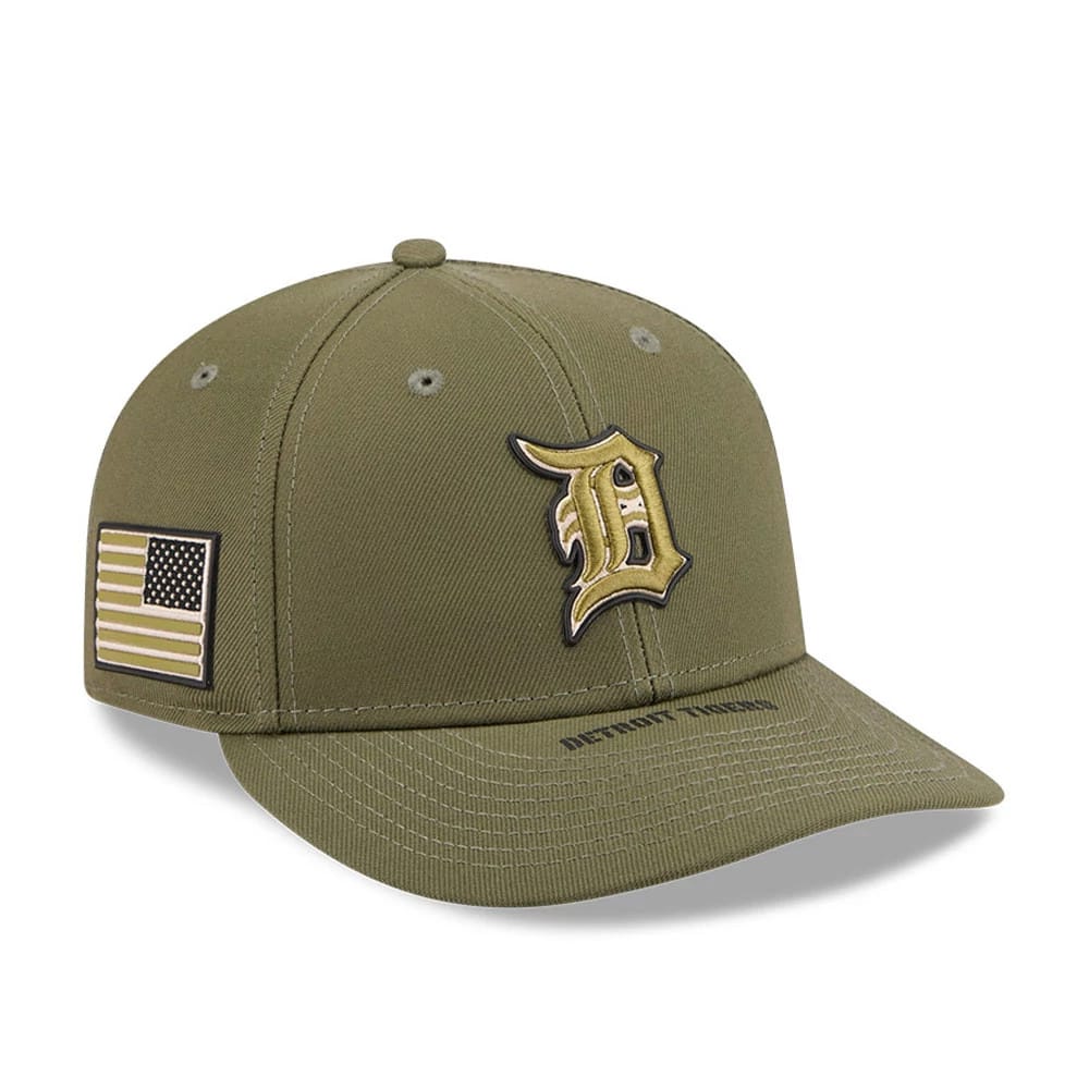 Tigers MLB Armed Forces Day 2026 Green Low Profile New Era 59FIFTY Fitted Cap, three-quarter view showing the raised gold embroidered D logo on the front panel, an embroidered American flag patch on the right side, and a green curved visor.