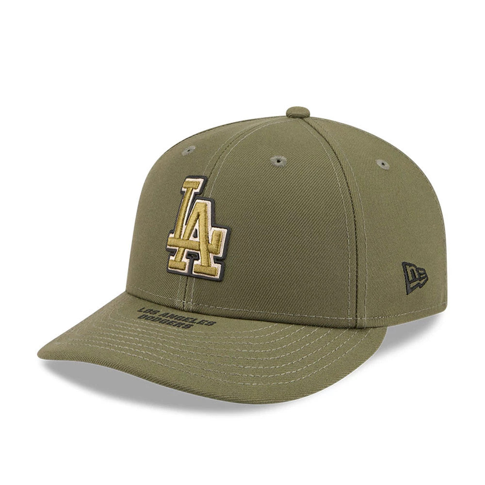 LA Dodgers MLB Armed Forces Day 2026 Green Low Profile New Era 59FIFTY Fitted Cap, three-quarter view showing the gold and black embroidered LA logo on the front panel, with black Los Angeles Dodgers text on the curved visor.