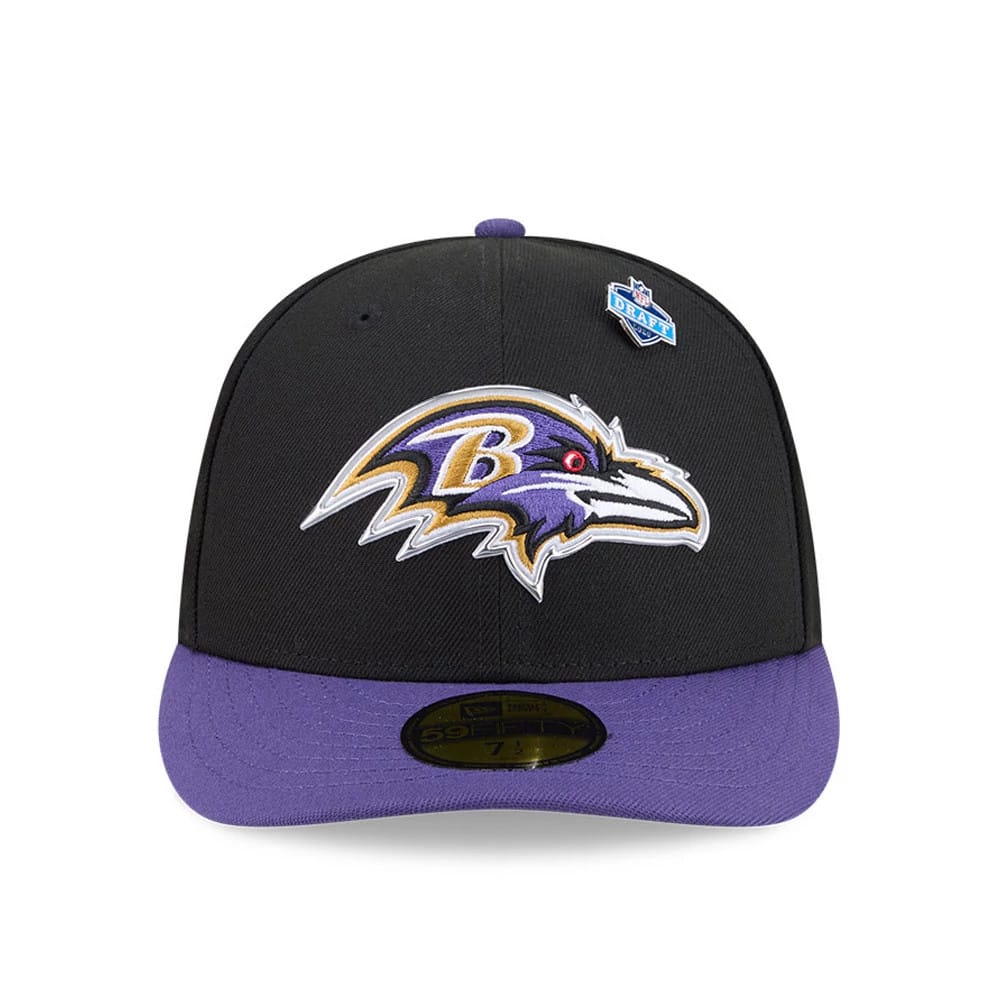 Baltimore Ravens NFL Draft 2026 Black New Era 59FIFTY Fitted Cap, front view showing the raised embroidered Ravens logo in purple and gold on the black crown, with a purple visor featuring a gold 59FIFTY size sticker and an NFL Draft shield pin.