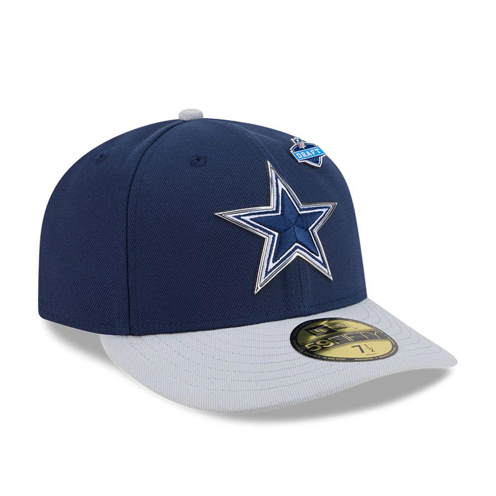 Dallas Cowboys NFL Draft 2026 Dark Blue New Era 59FIFTY Fitted Cap, three-quarter view showing a raised embroidered white and blue star logo on the front panel, grey visor with gold 59FIFTY size sticker, and NFL Draft pin on the crown.