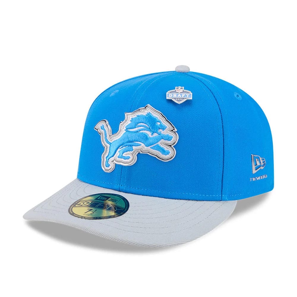 Detroit Lions NFL Draft 2026 Blue New Era 59FIFTY Fitted Cap, front view showing the large blue and grey embroidered Lions logo on the structured crown, grey visor with a gold 59FIFTY size sticker, and the New Era flag logo on the left side.