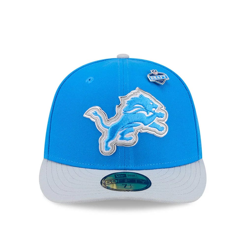 Detroit Lions NFL Draft 2026 Blue New Era 59FIFTY Fitted Cap, front view showing a raised light blue and white embroidered lion logo on the front panels, with a contrasting grey flat visor and a 59FIFTY size sticker on the visor.