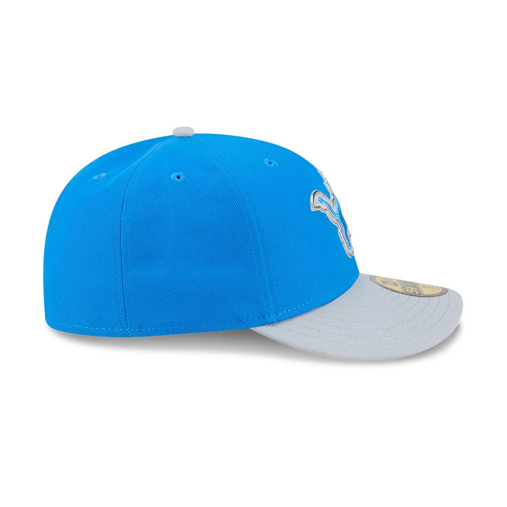 Detroit Lions NFL Draft 2026 Blue New Era 59FIFTY Fitted Cap, side view showing the structured blue crown with white embroidered team logo partially on the front panel, grey visor, and gold 59FIFTY size sticker on the visor.