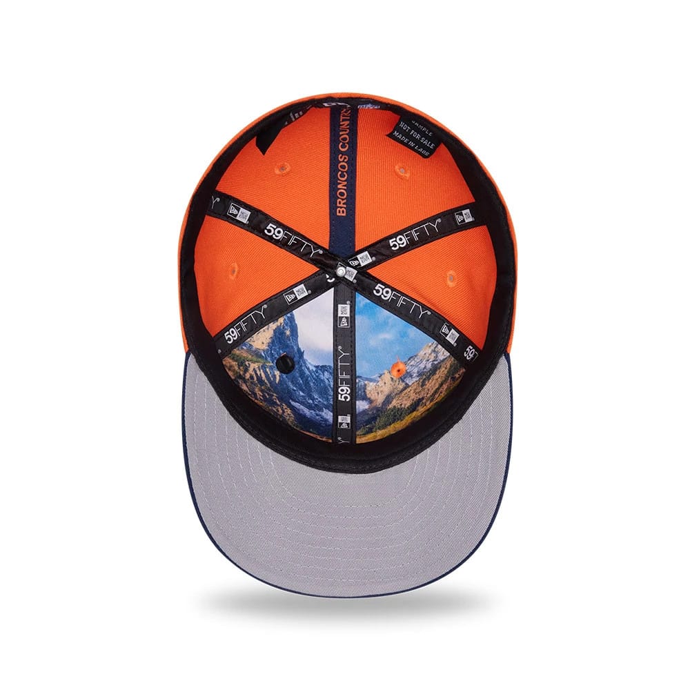 Denver Broncos NFL Draft 2026 Orange New Era 59FIFTY Fitted Cap, inside view showing a grey undervisor with mountain graphic interior panels, black 59FIFTY taping along the seams, and an orange Broncos Country sweatband.
