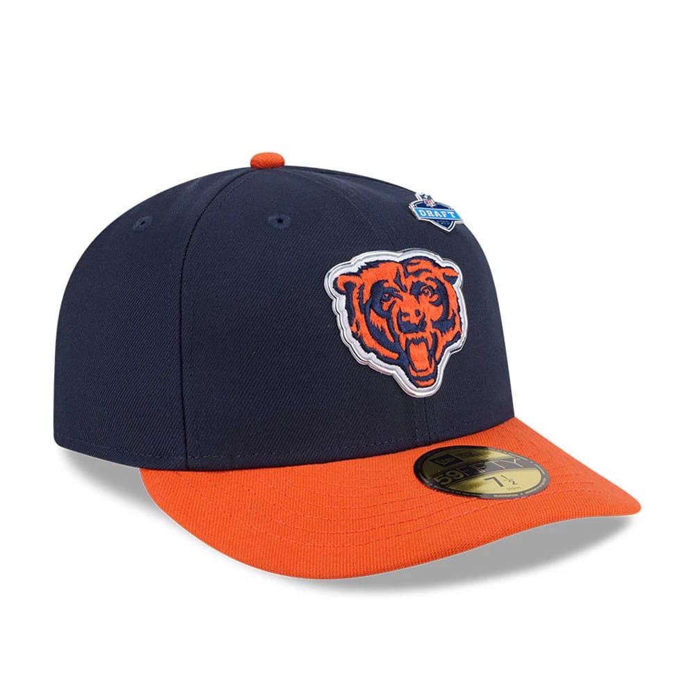 Chicago Bears NFL Draft 2026 Navy New Era 59FIFTY Fitted Cap, three-quarter view showing the raised embroidered orange bear head logo on the navy front panels, an orange flat visor with a gold 59FIFTY size sticker, and a blue NFL Draft pin.