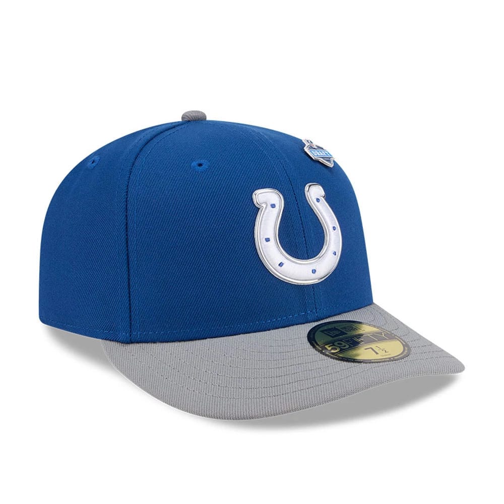 Indianapolis Colts NFL Draft 2026 Blue New Era 59FIFTY Fitted Cap, three-quarter view showing a raised white horseshoe logo on the front panel, complemented by a grey flat visor with a gold 59FIFTY size sticker.