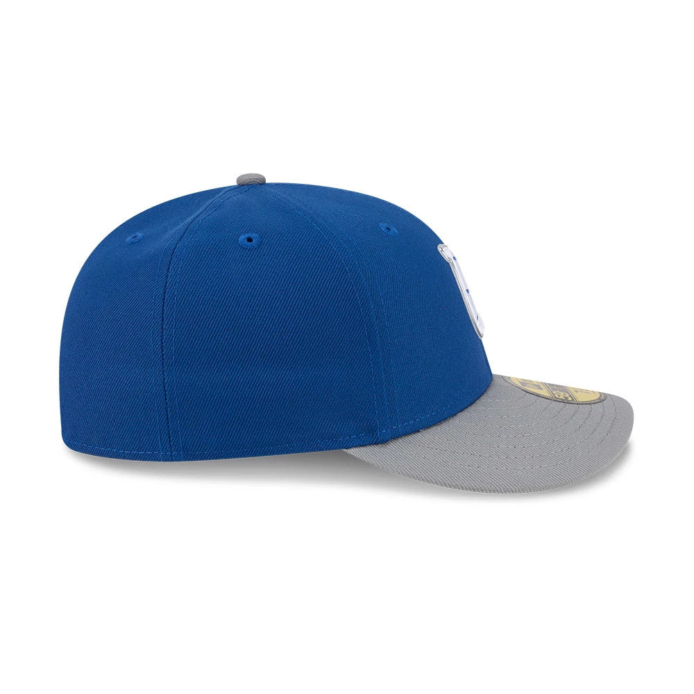 Indianapolis Colts NFL Draft 2026 Blue New Era 59FIFTY Fitted Cap, side view showing a grey curved visor with a gold 59FIFTY size sticker, a structured blue crown featuring embroidered logo details, and matching blue eyelets.