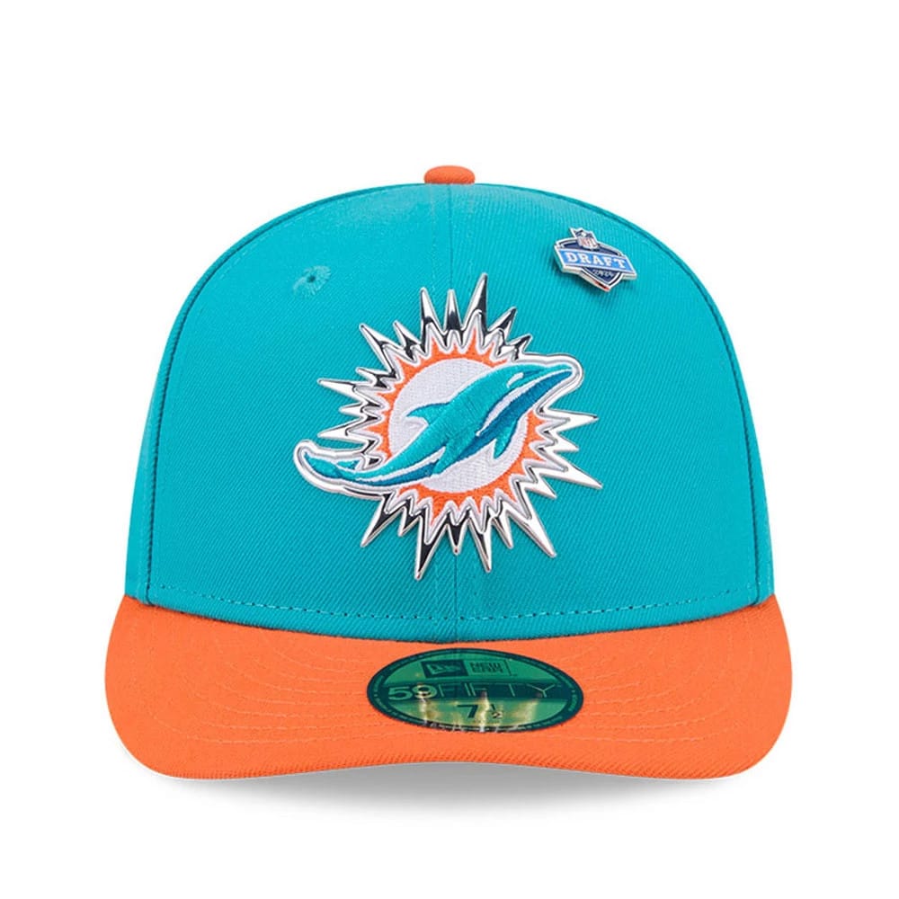 Miami Dolphins NFL Draft 2026 Turquoise New Era 59FIFTY Fitted Cap, front view showing the raised embroidered Dolphins logo on the structured turquoise crown, with an orange visor, a draft pin, and a green 59FIFTY size sticker on the visor.