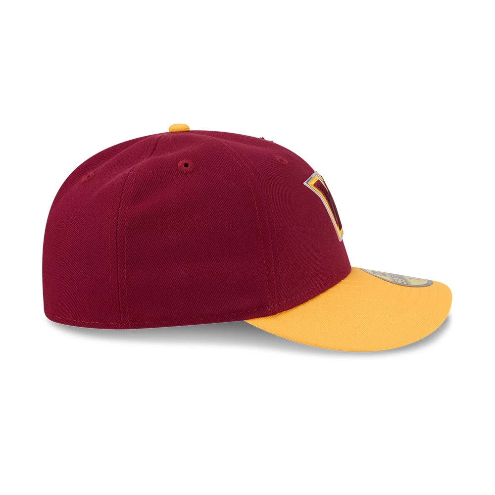 Washington Commanders NFL Draft 2026 Dark Red New Era 59FIFTY Fitted Cap, side view showing the dark red crown with red embroidered eyelets, a yellow flat visor, and the front panel logo extending toward the visor.