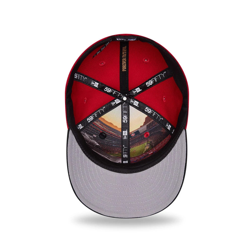 San Francisco 49ers NFL Draft 2026 Red New Era 59FIFTY Fitted Cap, inside view showing a detailed graphic of a stadium on the inner panels, black 59FIFTY and New Era branded taping, and a grey undervisor contrasting with the red sweatband.