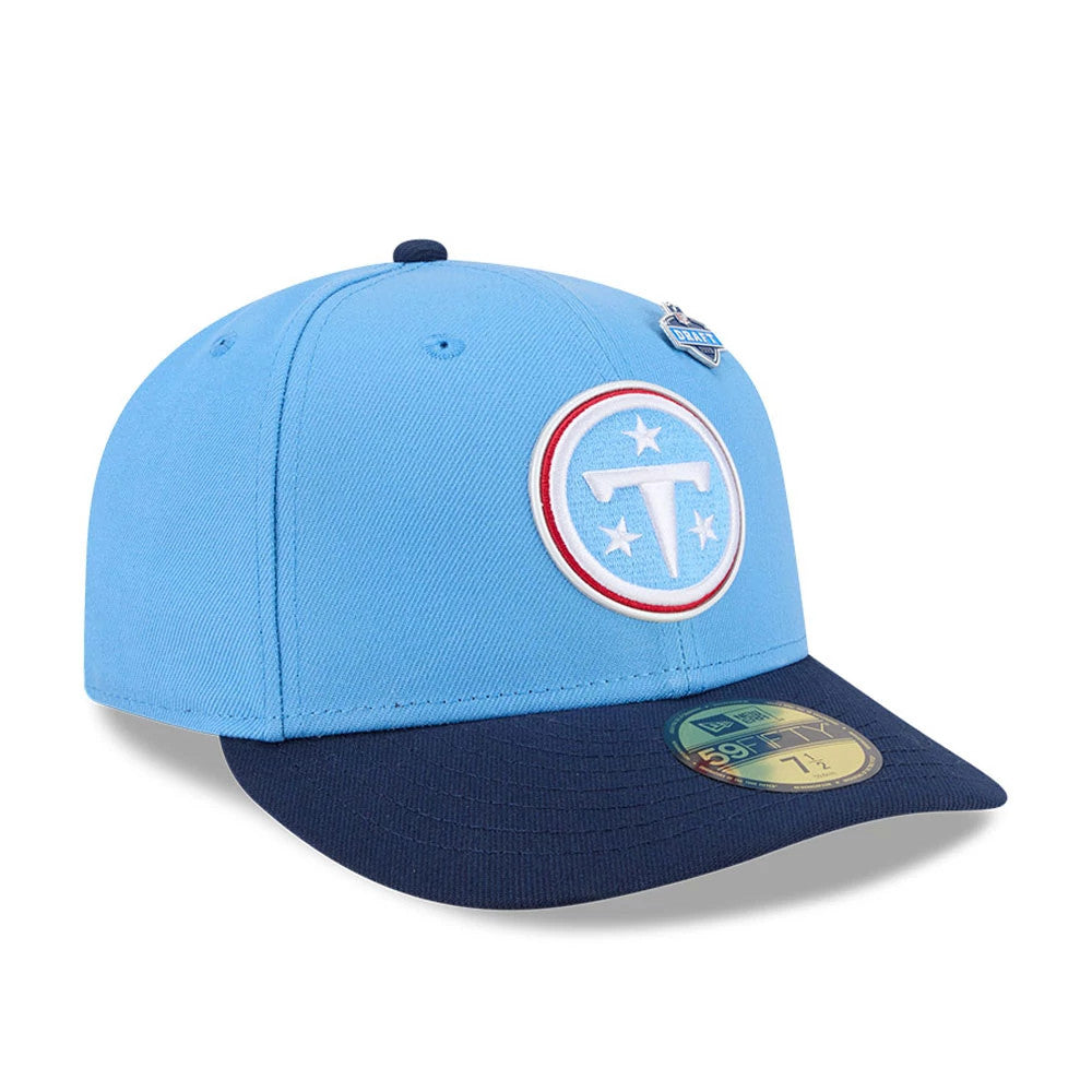 Tennessee Titans NFL Draft 2026 Blue New Era 59FIFTY Fitted Cap, three-quarter view showing the white and blue embroidered Titans logo on the front panel, a blue flat visor with gold 59FIFTY size sticker, and the NFL Draft pin beside the top button.
