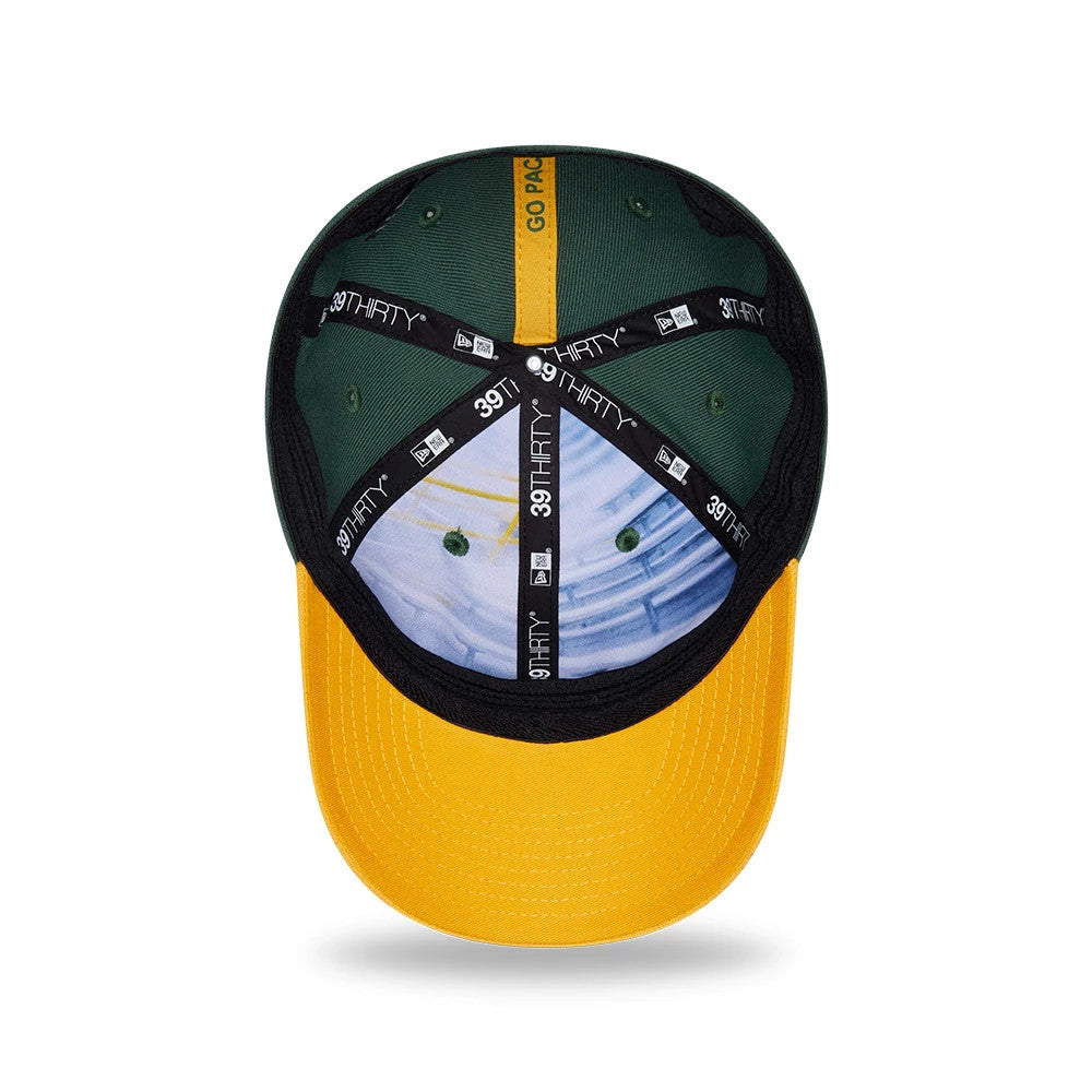 Packers NFL Draft 2026 Dark Green New Era 39THIRTY M-Crown Stretch Fit Cap, inside view showing the black 39THIRTY branded taping across the green panels, a detailed printed fabric against the crown.