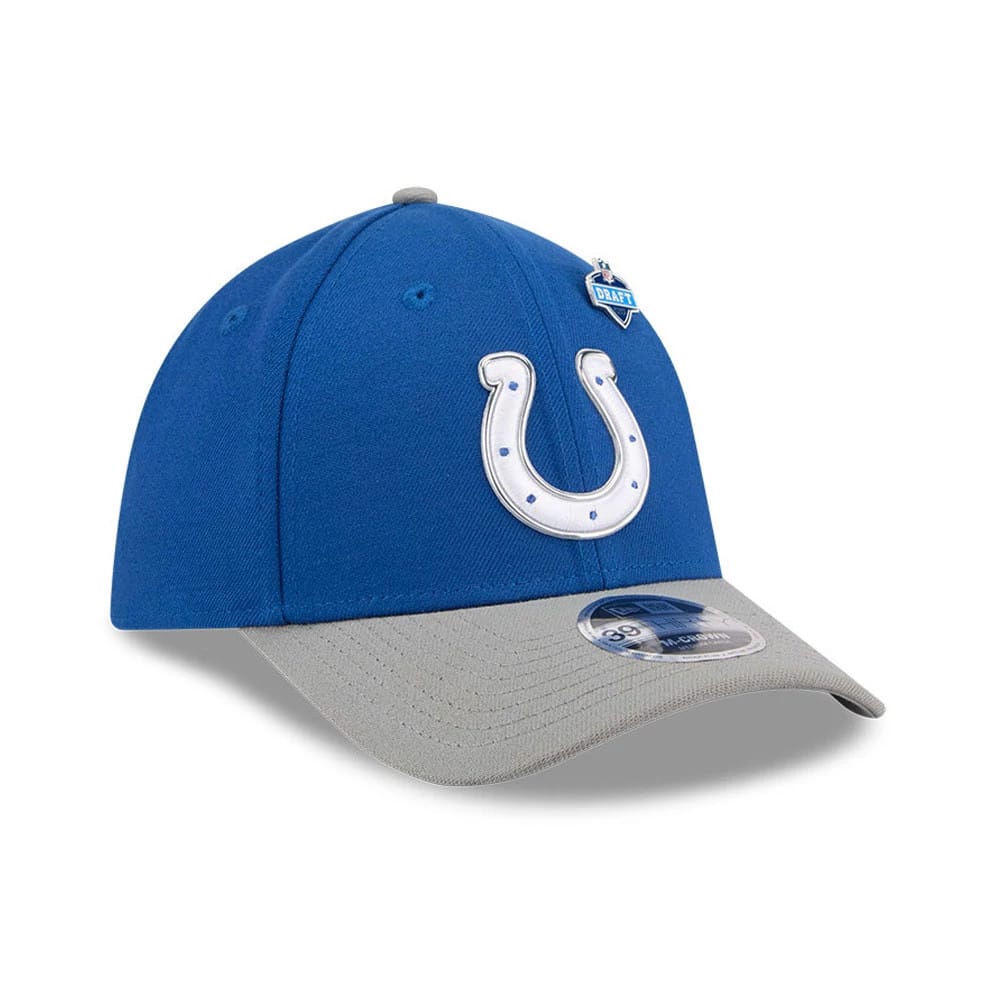 Indianapolis Colts NFL Draft 2026 Blue New Era 39THIRTY M-Crown Stretch Fit Cap, three-quarter view showing the white horseshoe logo embroidered on the blue front panel, with a contrasting grey curved visor and a 39THIRTY size sticker on the top.