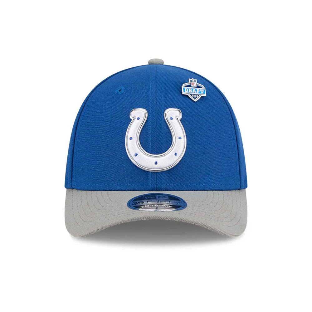 Indianapolis Colts NFL Draft 2026 Blue New Era 39THIRTY M-Crown Stretch Fit Cap, front view showing the raised white horseshoe logo with blue details on the blue crown, grey curved visor, and 39THIRTY size sticker and NFL Draft pin on the right.