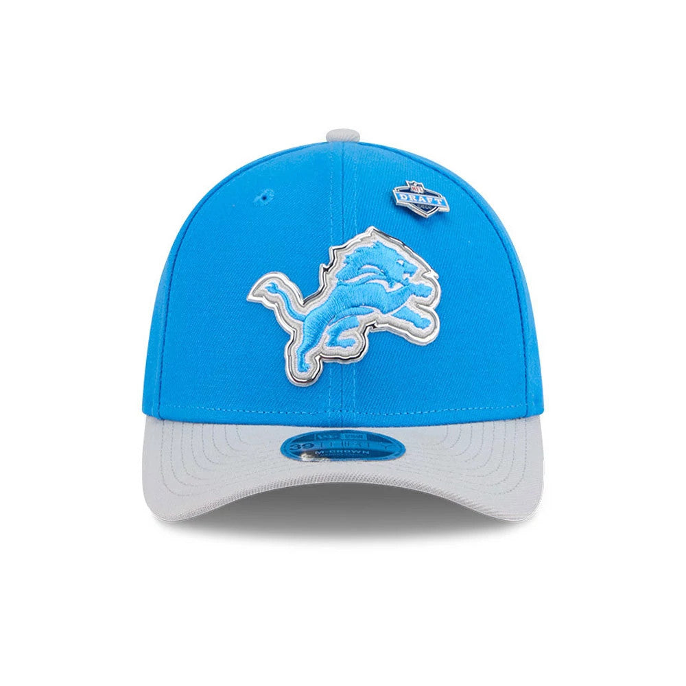 Detroit Lions NFL Draft 2026 Blue New Era 39THIRTY M-Crown Stretch Fit Cap, front view showing the raised light blue lion logo with white outline on the front panel, grey curved visor underneath a blue crown, and a 39THIRTY size sticker.