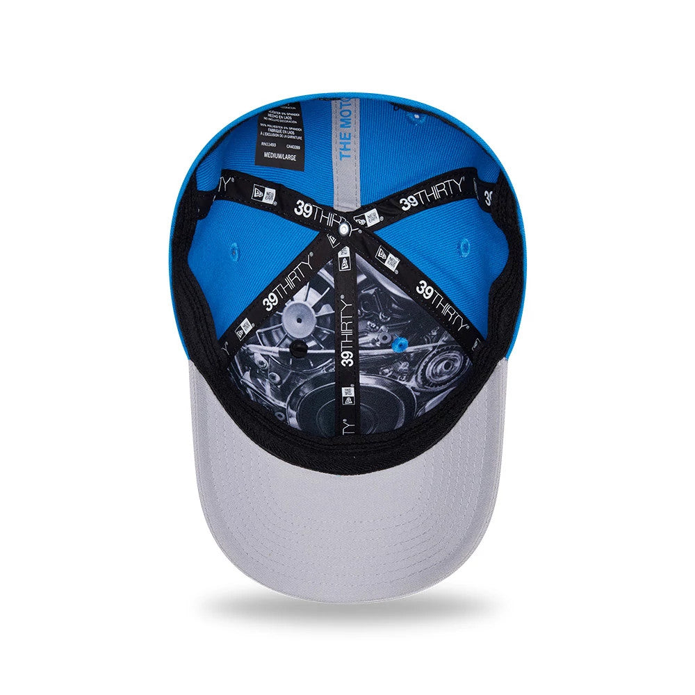 Detroit Lions NFL Draft 2026 Blue New Era 39THIRTY M-Crown Stretch Fit Cap, inside view showing the black 39THIRTY taping, black sweatband, and printed graphics on the panels, with a blue undervisor and multiple size labels.