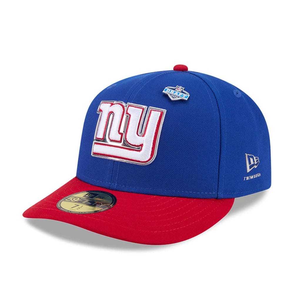 New York Giants NFL Draft 2026 Blue New Era 59FIFTY Fitted Cap, three-quarter view showing raised white and red embroidered NY logo on blue front panel, red flat visor with gold 59FIFTY size sticker, and silver New Era flag on the left side.