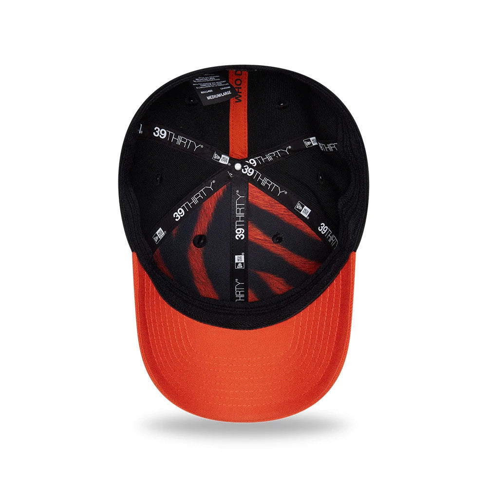 Cincinnati Bengals NFL Draft 2026 Black New Era 39THIRTY M-Crown Stretch Fit Cap, inside view showing orange tiger-stripe pattern on the crown, black taping with 39THIRTY branding, and orange curved undervisor.