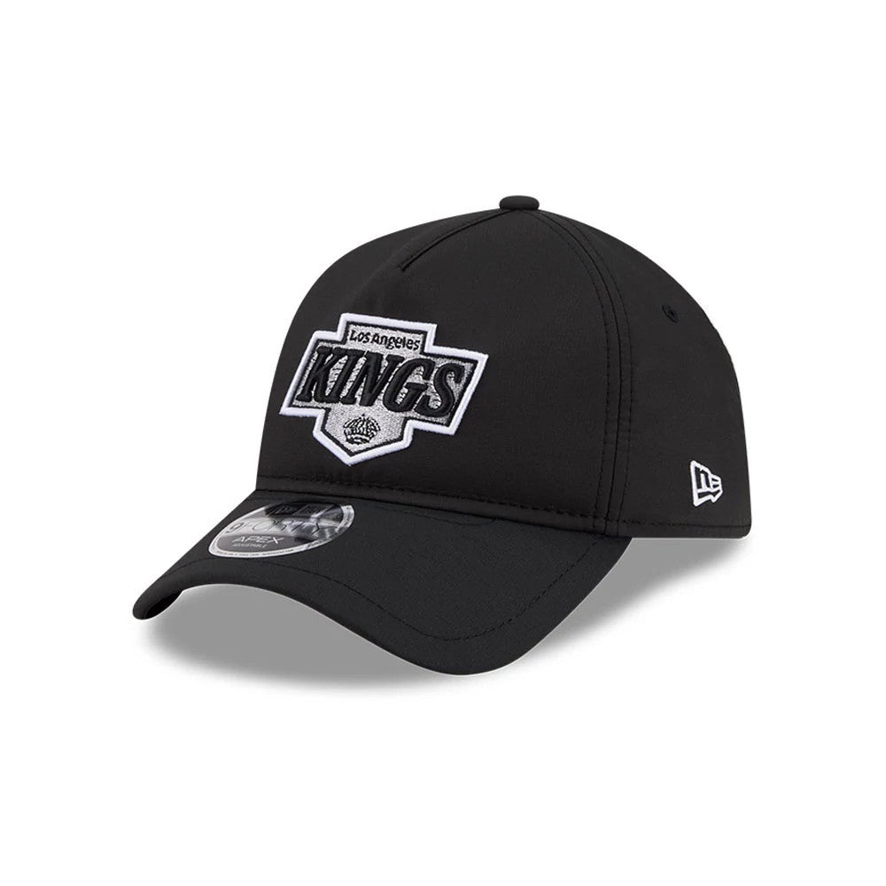 Los Angeles Kings NHL Quickstrike Black New Era 9FORTY Apex Adjustable Cap, three-quarter view showing a raised embroidered Los Angeles Kings logo on the front panel, a curved black visor with a 9FORTY size sticker.